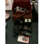 A SELECTION OF VINTAGE CAMERAS AND BINOCULARS AND A LARGE BOX CONTAINING A SLIDE PLUS JECTOR 150 D