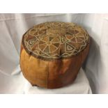 A VINTAGE LEATHER POUFFE/FOOTSTOOL