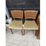 A PAIR OF RETRO TEAK POSSIBLY DANISH DESIGN DINING CHAIRS WITH SPLIT CANE BACKS