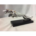 A CHROME JAGUAR CAR MASCOT ON BASE