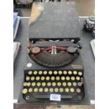 A VINTAGE REMINGTON PORTABLE TYPE WRITER