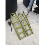 A PAIR OF METAL CAR RAMPS AND A FURTHER BOTTLE JACK