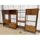A STAPLES LADDERAX FURNITURE FOUR SECTION WALL UNIT ENCLOSING CUPBOARDS, SHELVES AND DRAWERS ETC,