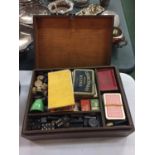 A WOODEN BOX OF VINTAGE GAMES TO INCLUDE SNAKES AND LADDERS AND CARD GAMES