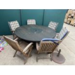 A ROUND RATTAN GARDEN TABLE AND SIX FOLDING TEAK GARDEN CHAIRS