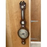 A LARGE DECORATIVE OAK BAROMETER