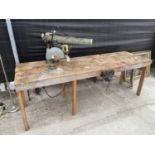 A LARGE INDUSTRIAL HEAVY DUTY WORK BENCH WITH RECORD BENCH VICE AND DEWALT CIRCULAR SAW