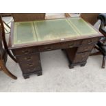 A REPRODUCTION MAHOGANY KNEEHOLE DESK WITH EIGHT DRAWERS AND INSET LEATHER TOP, 48" X 24"