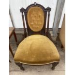 A VICTORIAN WALNUT NURSING CHAIR ON TURNED AND FLUTED LEGS, WITH BUTTON-BACK