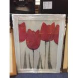 A WHITE FRAMED PICTURE OF RED TULIPS