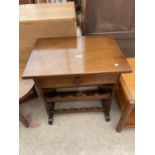 A SMALL OAK OCCASIONAL TABLE WITH SINGLE DRAWER AND ACCOMODATION FOR TEN WINE BOTTLES