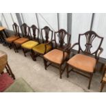 A SET OF SIX HEPPLEWHITE STYLE DINING CHAIRS ON TAPERED LEGS, WITH SPADE FEET, TWO BEING CARVERS