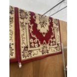 A RED AND IVORY PATTERNED MARAKESH RUG (170 X 120)