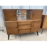 A RETRO TEAK BEAUTILITY SIDEBOARD ENCLOSING DRAWERS, CUPBOARDS AND GLASS SLIDING DOORS, 48" WIDE