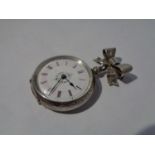 A SILVER FOB WATCH ON A SILVER BOW BROOCH