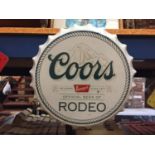 A BOTTLE CAP SHAPED SIGN - COORS