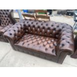 A BROWN BUTTON BACK CHESTERFIELD SETTEE