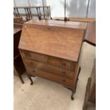 AN EDWARDIAN MAHOGANY BUREAU ON CABRIOLE LEGS, 30" WIDE