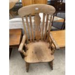 A VICTORIAN STYLE BEECH ROCKING CHAIR