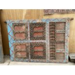 A LARGE DECORATIVE CARVED MOROCCAN DOOR WITH METAL STUD WORK AND BANDING (W:55.5" H:76.5")