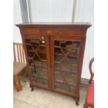 AN EDWARDIAN MAHOGANY AND INLAID ASTRAGAL GLAZED TWO DOOR BOOKCASE ON CABRIOLE LEGS, 39" WIDE