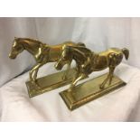 A PAIR OF HEAVY BRASS HORSE DOORSTOPS/ FIRESIDE ORNAMENTS