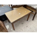 A RETRO TEAK EFFECT TWO TIER COFFEE TABLE ON WHEELS