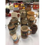 AN ASSORTMENT OF CERAMIC TANKARDS AND JUGS