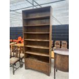 A MID 20TH CENTURY OAK OPEN BOOKCASE WITH CUPBOARDS TO THE BASE, 42" WIDE, 93.5" HIGH