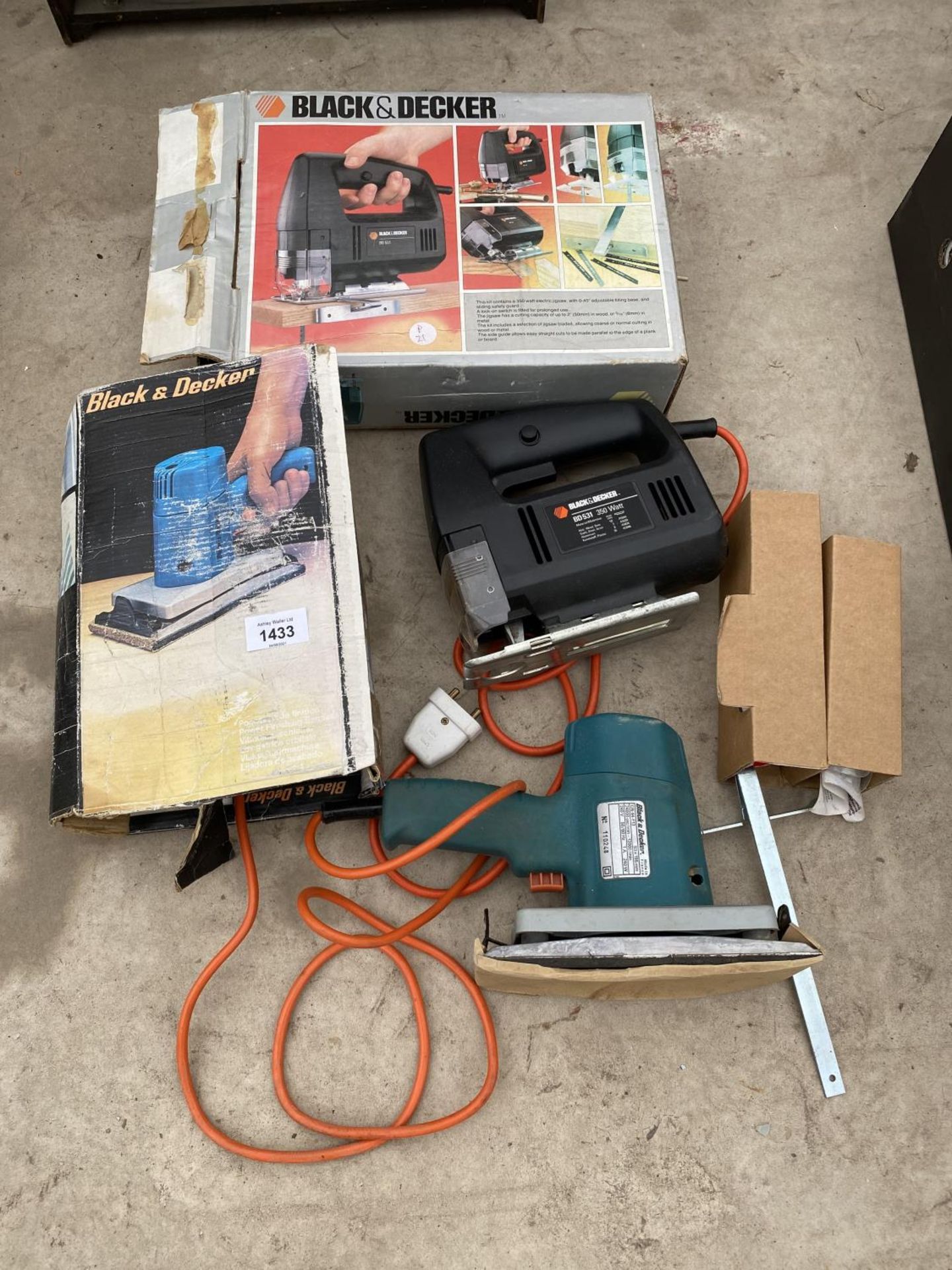 A BLACK AND DECKER SANDER AND A BLACK AND DECKER JIGSAW