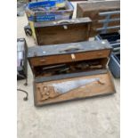 A PAIR OF VINTAGE WOODEN JOINERS CHESTS WITH AN ASSORTMENT OF TOOLS TO INCLUDE SAWS, CHISELS AND