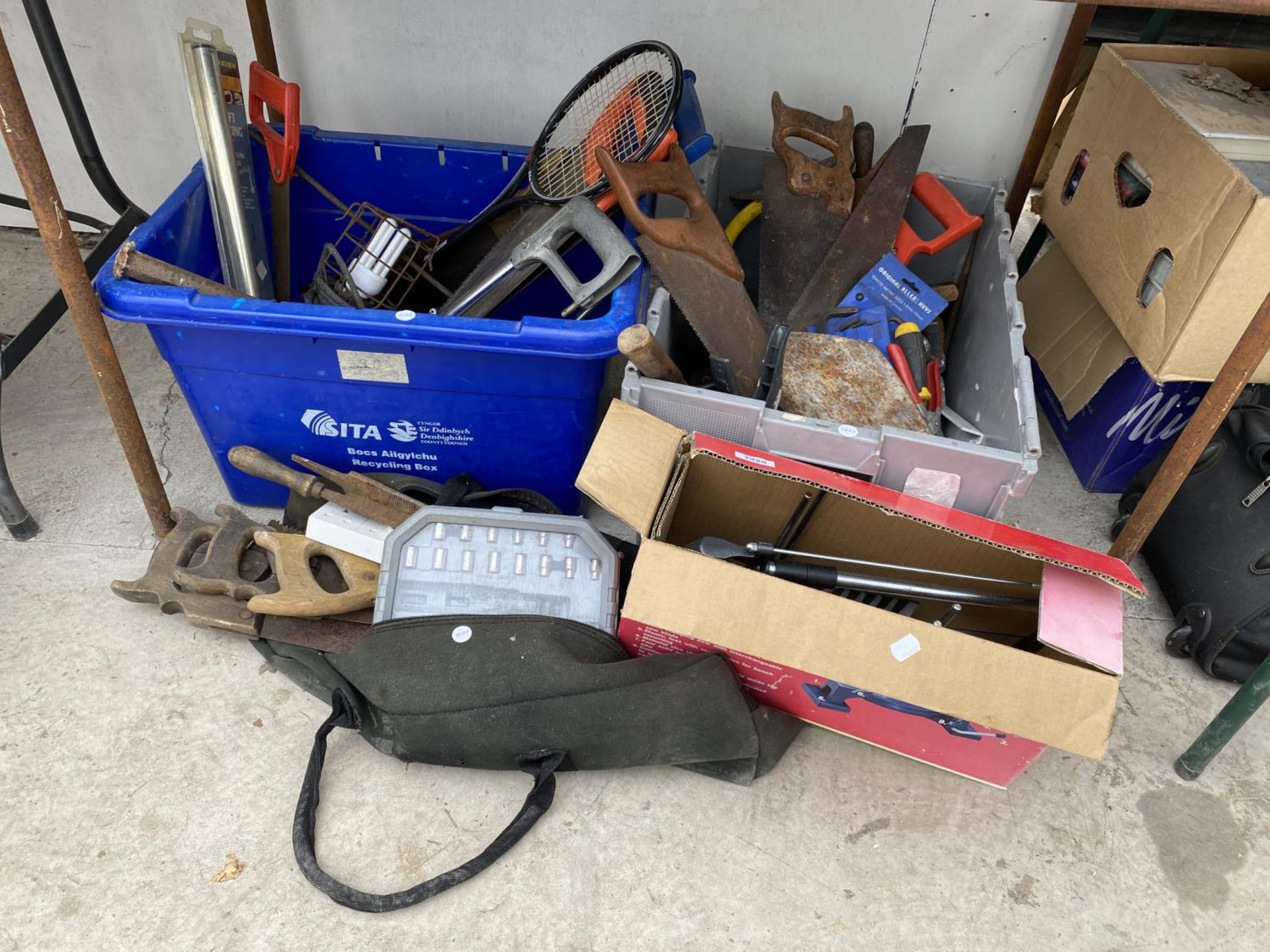 AN ASSORTMENT OF TOOLS TO INCLUDE SAWS, TROWELS AND A MITRE SAW ETC