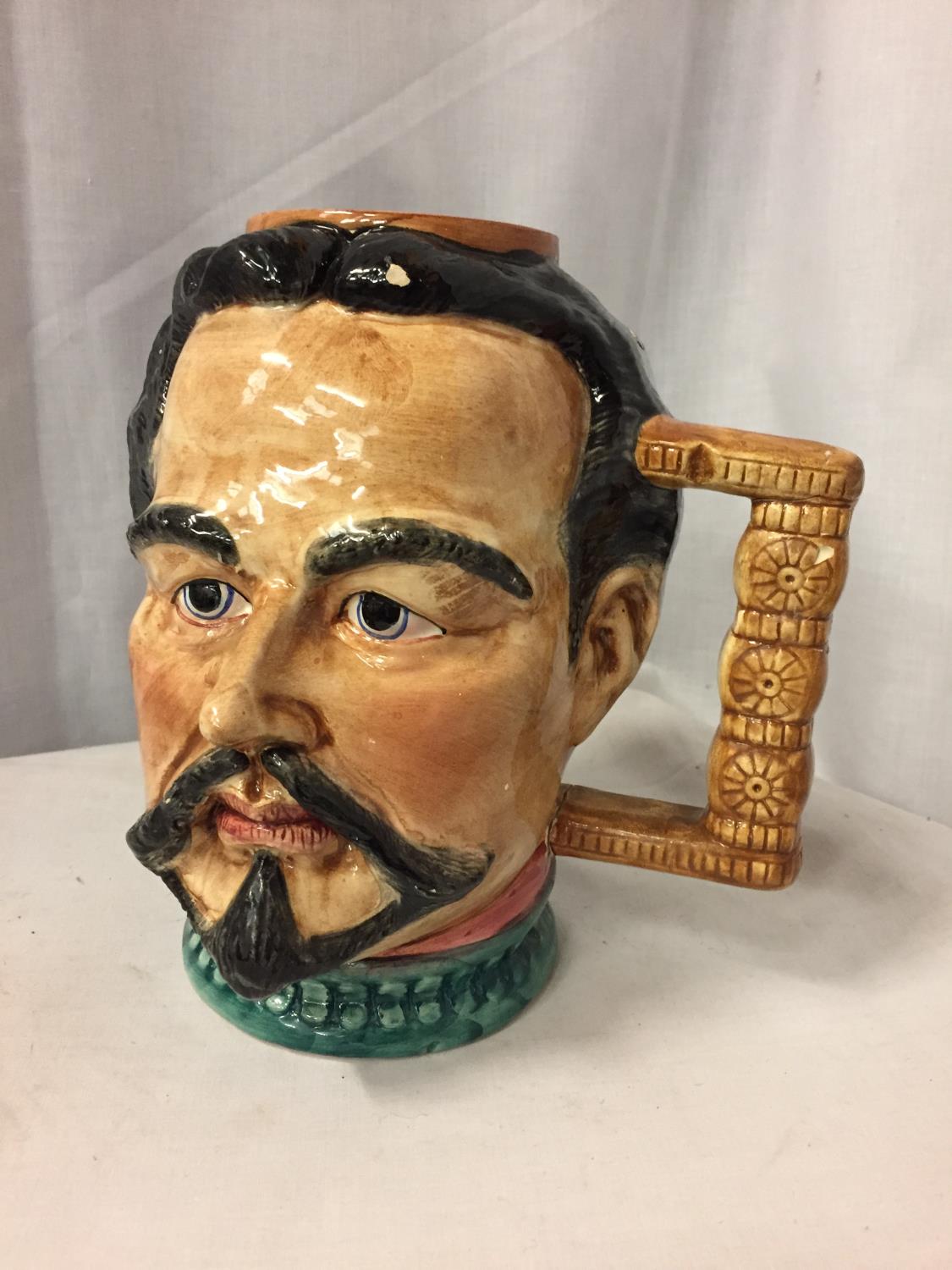 A LARGE CERAMIC HANDLED JUG IN THE FORM OF A MANS HEAD (A/F) H-24CM