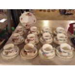 A DUCHESS PART TEA SET COMPRISING SIX TRIOS, SUGAR BOWL, MILK JUG, CAKE PLATE AND FURTHER SIX