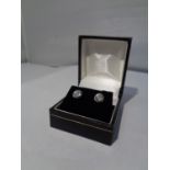 A PAIR OF 18 CARAT WHITE GOLD AND DIAMOND EARRINGS IN A PRESENTATION BOX