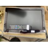 A 19" SAMSUNG TELEVISION WITH REMOTE CONTROL