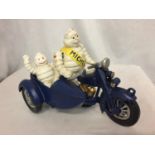 A CAST MICHELIN MAN ON A MOTOR BIKE