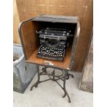 AN INDUSTRIAL TYPEWRITER TABLE/STAND DESK MANUFACTURED BY TOLEDO AND CONTAINING AN UNDERWOOD VINTAGE