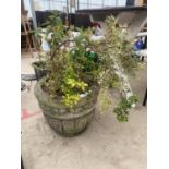 A CIRCULAR STONE EFFECT GARDEN PLANTER