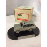 A PEWTER LAND ROVER RANGE ROVER ON A PLINTH WITH A BOX