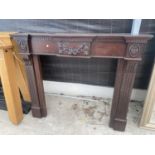 A MAHOGANY FIRE SURROUND