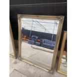 A LARGE DECORATIVE GILT FRAMED OVER MANTLE MIRROR