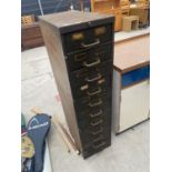 A VINTAGE 11 DRAWER METAL STORAGE UNIT