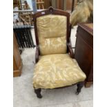 A VICTORIAN WALNUT NURSING CHAIR ON TURNED AND FLUTED LEGS