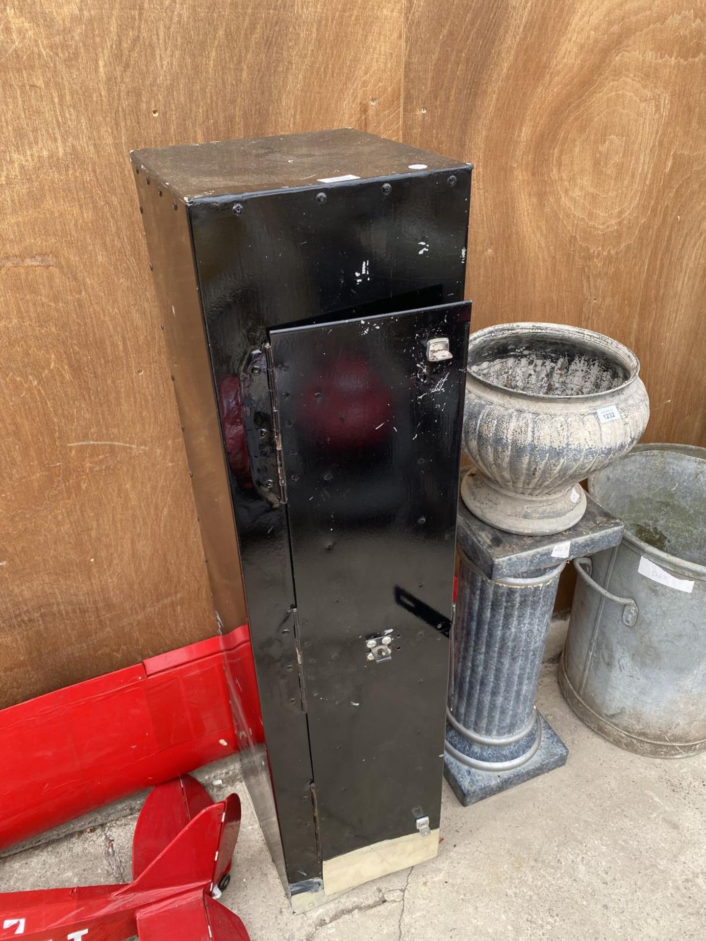 A METAL LOCKER CABINET WITH TWO KEYS