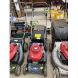 A PETROL HONDA LAWN MOWER WITH GRASS BOX AND ENGINE IN WORKING ORDER BUT NO WARRANTY AND A SMALL