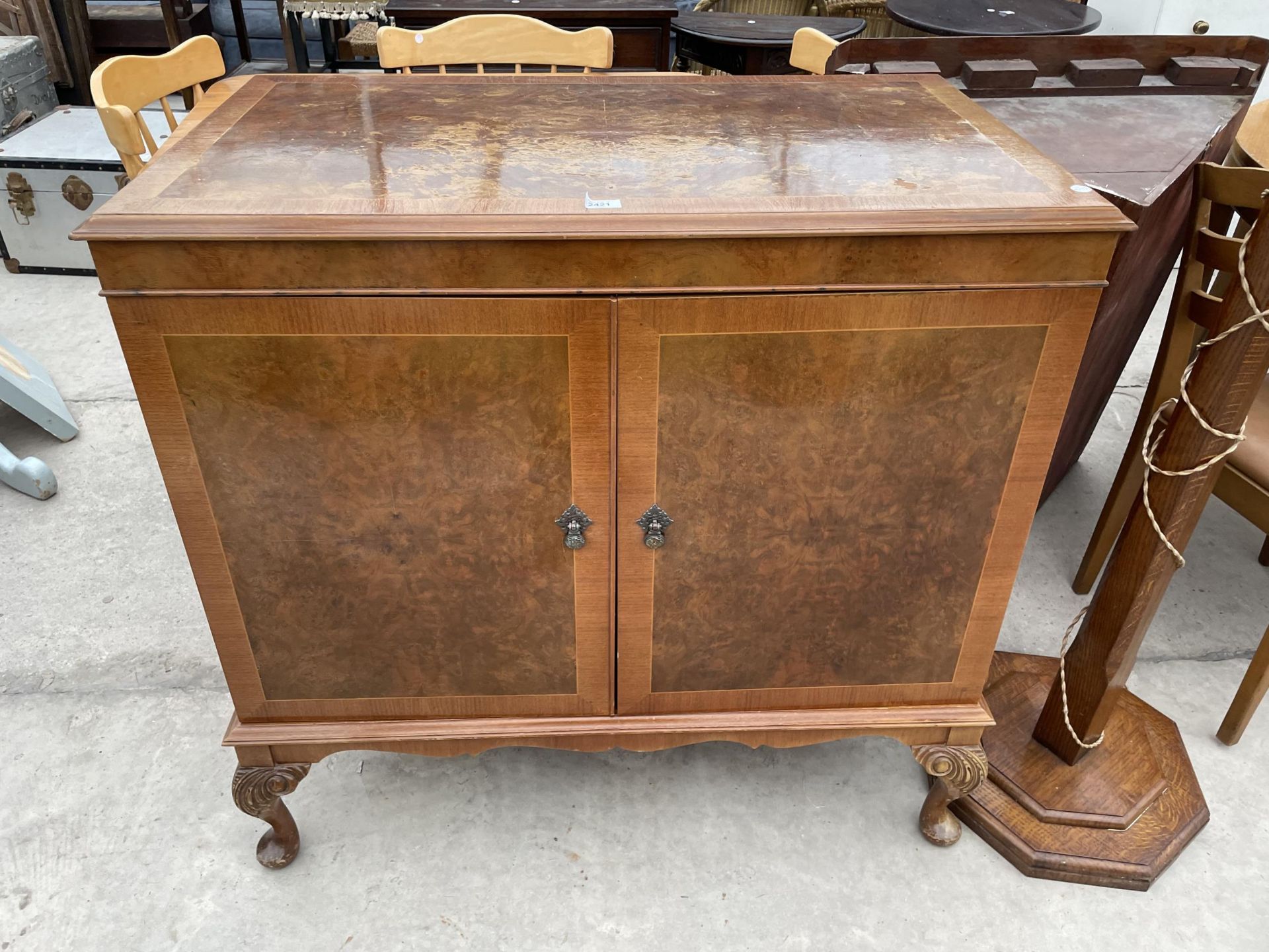 A WALNUT AND CROSSBANDED CHARLES SHERATON STEREO CABINET