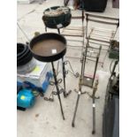 AN ASSORTMENT OF ITEMS TO INCLUDE TWO IRON PLANT STANDS, DECORATIVE BRASS FIRE DOGS AND A STICK