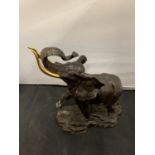 A 1991 FRANKLIN MINT CAST BRONZE "GIANT OF THE SERENGETI" ELEPHANT WITH GOLD COLOURED TUSKS