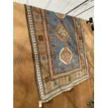 A KAZAX STYLE FRINGED PATTERNED RUG